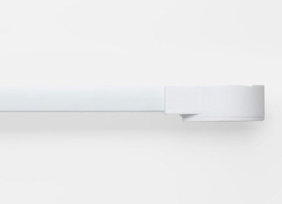 The Shade Store Motorized drapery hardware laid out on a white table top