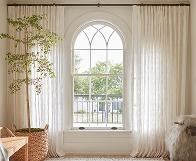 Arch window curtains made of Feather Palm Embroidery, Vintage Lace, add elegance to a standard arch window