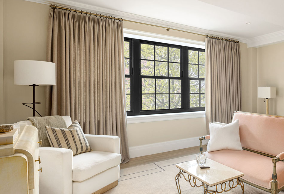 Best curtains for living room comfort feature Tailored Pleat Drapery made of Lowell Tweed in Oak in a cozy seating area