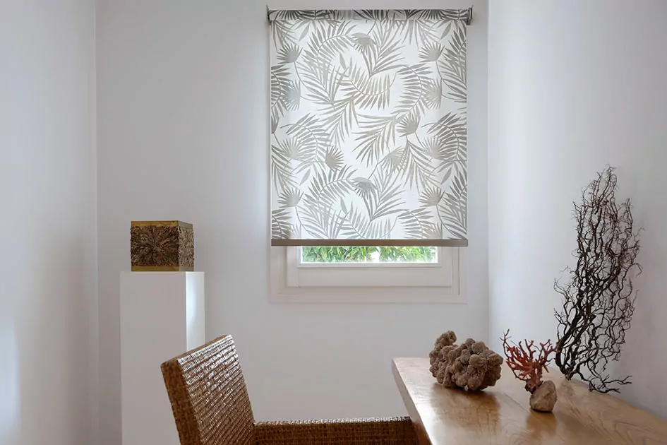 Office window with palm-pattern roller shade, showcasing modern window shade styles and versatile shade options for workspaces