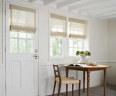 A door window shade is made of a Waterfall Woven Wood Shade in Grassweave, Hemp works as a front door window treatment.
